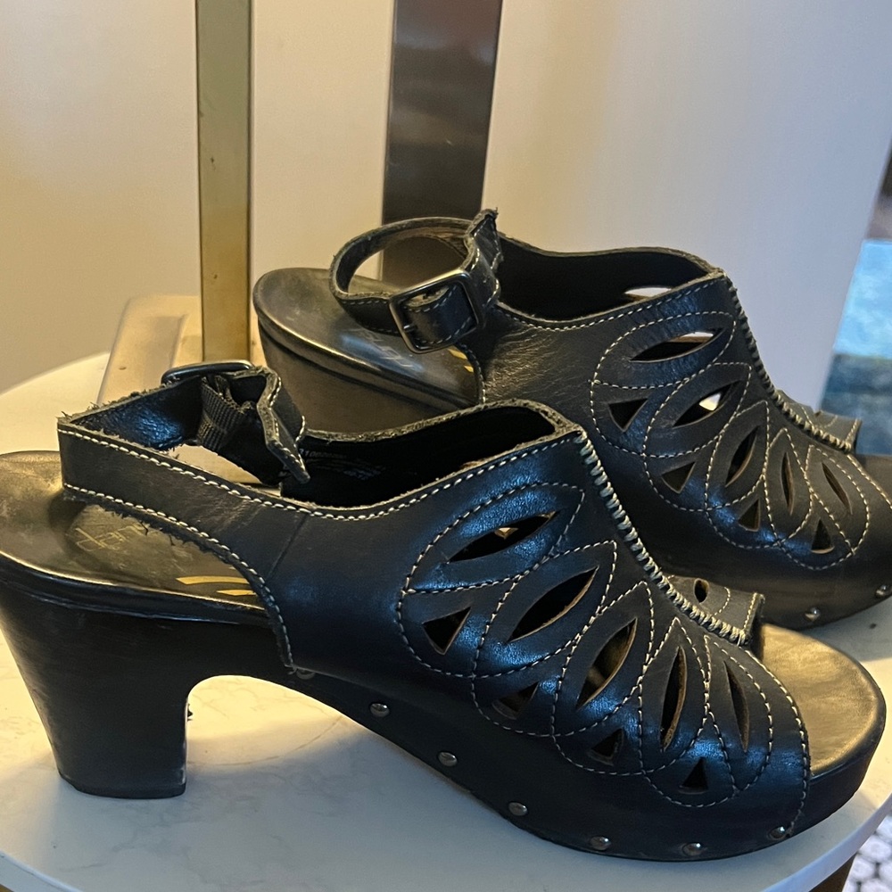 Dansko Black Leather Mules with Cutout Design
